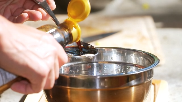 Soy sauce being poured into a bowl