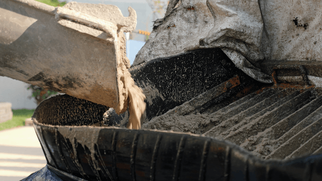 Concrete being poured into a mixer