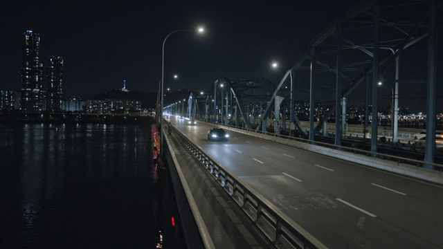 Night view of a bridge with city lights