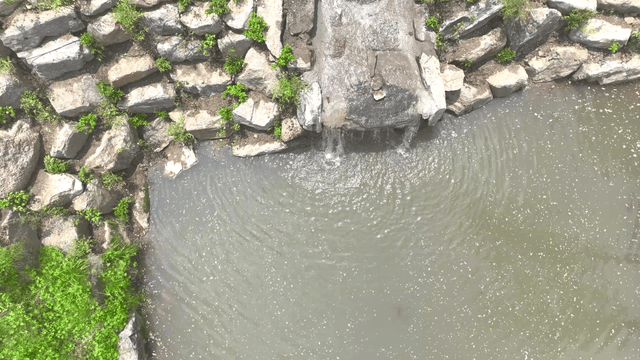 A small waterfall flowing along an artificial waterway