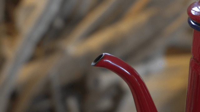 Steaming red kettle spout