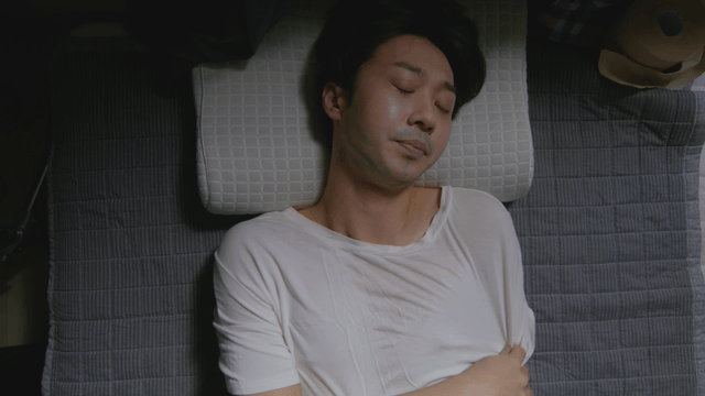 Man sleeping peacefully indoors
