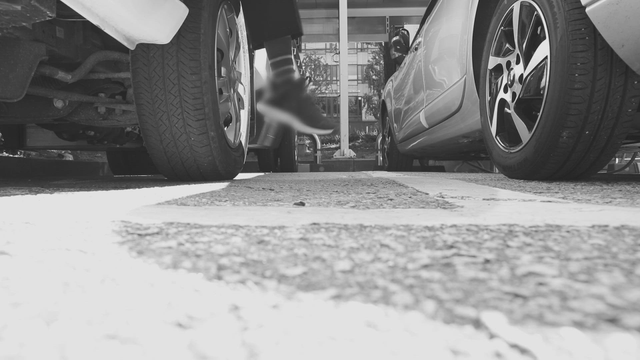 Person getting out of a parked car