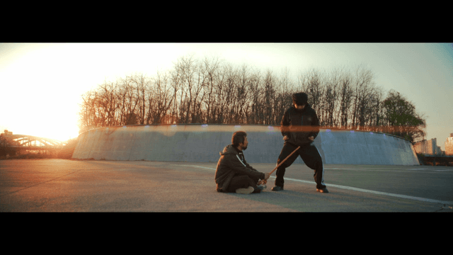 Two people practicing martial arts outdoors