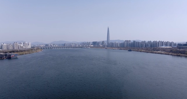 A wide river with a city skyline