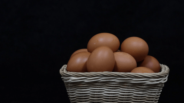 Basket filled with brown eggs