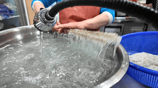 Fresh ice fish washed in large basin
