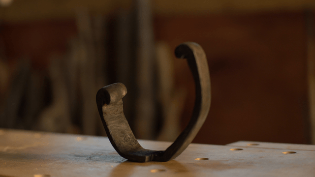 Unique wooden sculpture on woodworking table