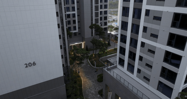 Modern apartment complex with trees