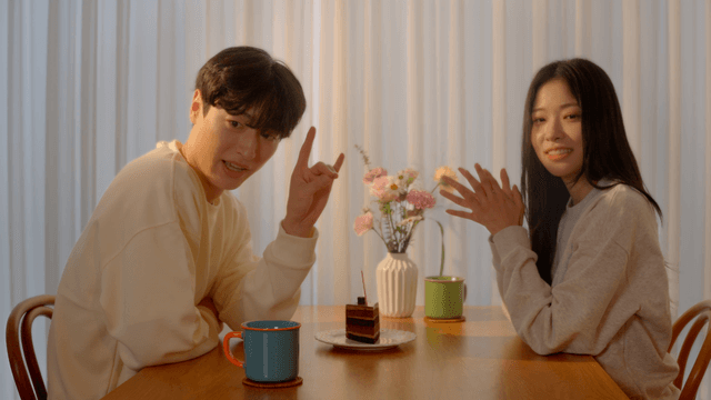 Couple playing shadow game at dining table