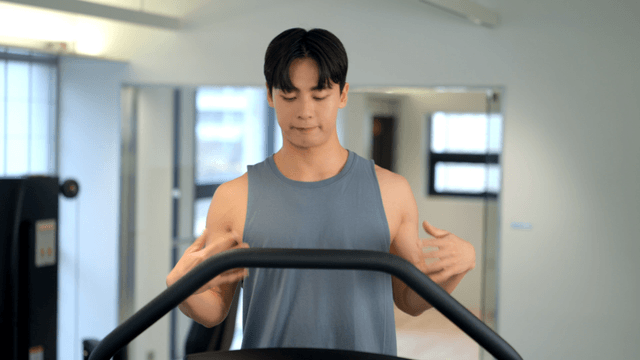 Man waking on a treadmill at gym