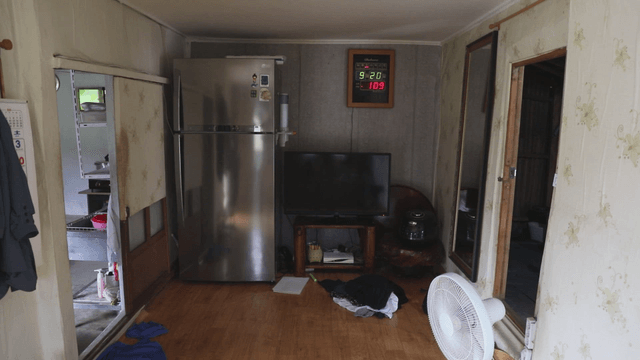 Simple living room with household items