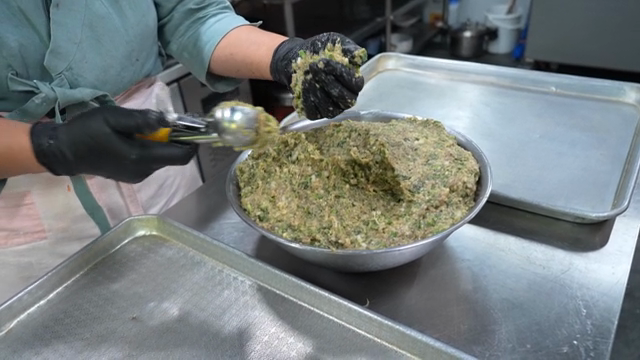 Dumpling filling shaped with an scoop