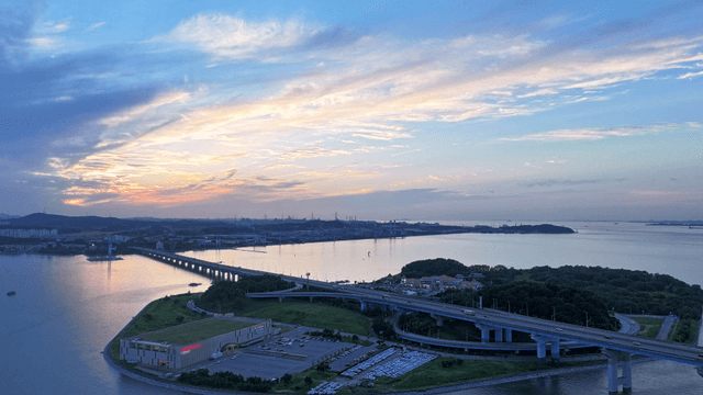 Serene sunset over a coastal bridge
