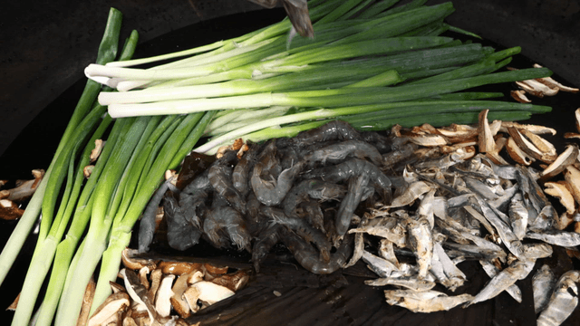 Various broth ingredients in commercial pot