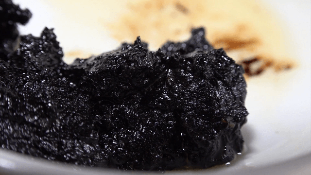 Thick black soybean paste on a white plate