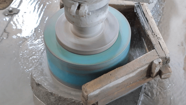 Grinding machine operating rapidly on basalt