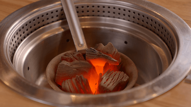 Charcoal burning in a metal grill