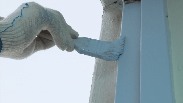 Brush painting precisely along a door frame