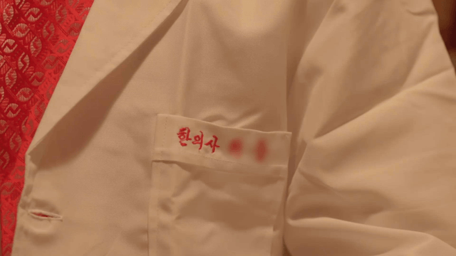 Close-up of Korean medicine doctor’s white coat
