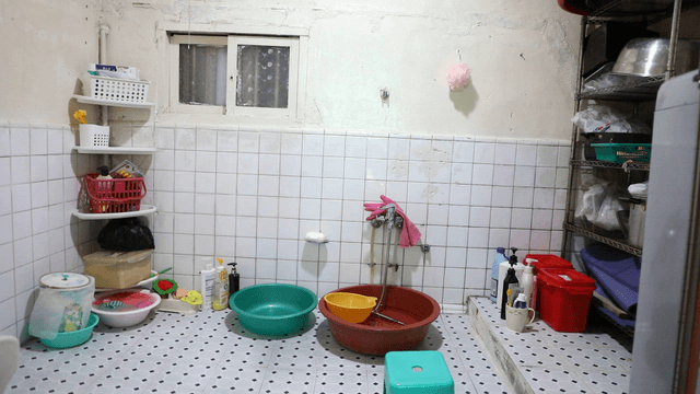 Simple bathroom with cleaning supplies