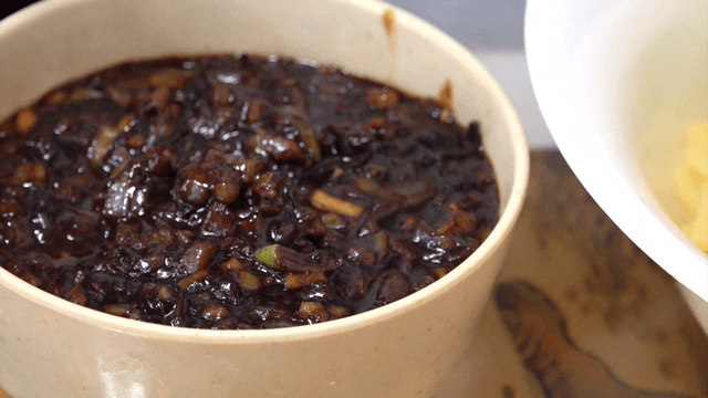 Thick black bean sauce prepared in a bowl
