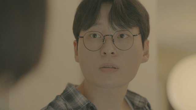 Slightly surprised young man wearing glasses