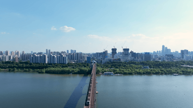 Train and railway connecting the city over the river