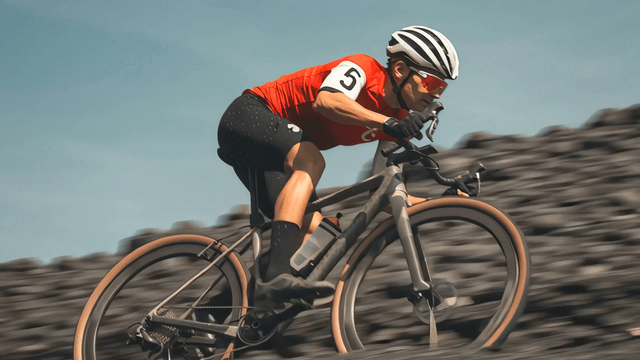 Cyclist racing on a rugged outdoor trail