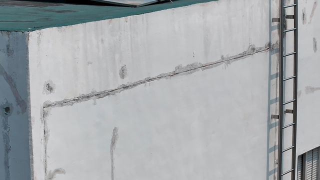 A building corner with visible cracks