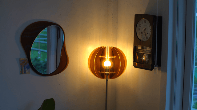 Cozy corner with modern lamp and classic clock