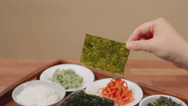 Korean side dishes with rice and seaweed