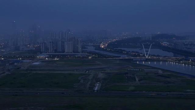 City skyline at dusk with river view
