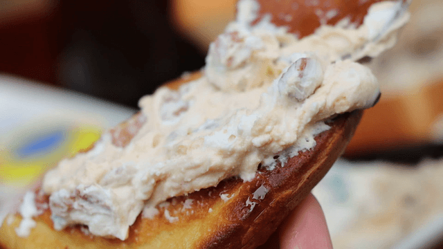 Yogurt spread on bread with a spoon