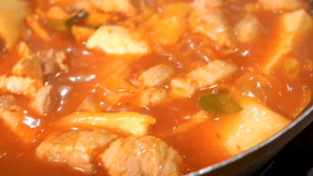 Boiling kimchi stew with pork and tofu in pot