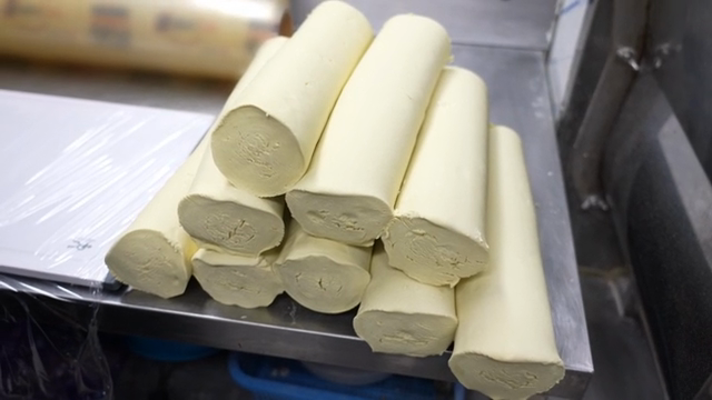 Dough being prepared in a kitchen