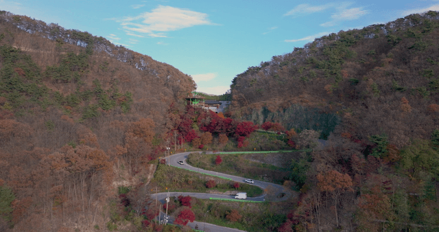 Winding mountain road with autumn foliage