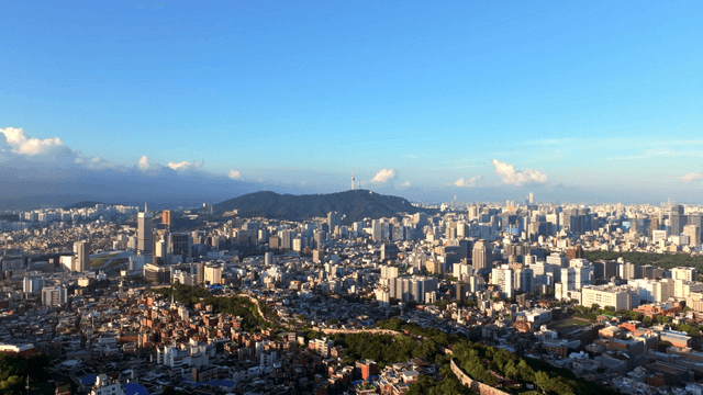 Sprawling cityscape with distant mountains