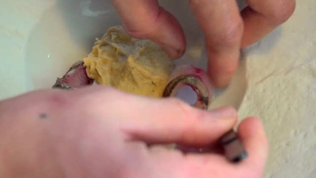 Chef preparing a dish with fish and puree