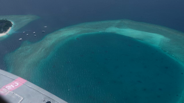 Aerial view of a tropical island and reef