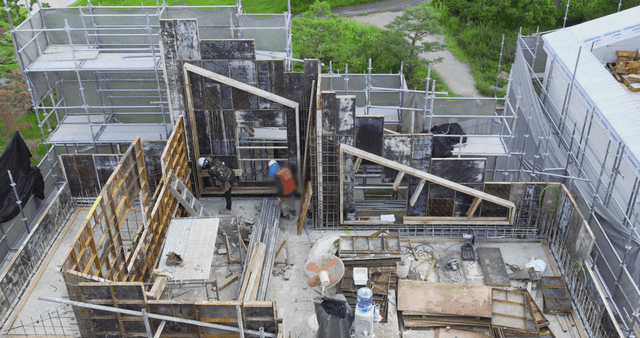 Construction site with workers and scaffolding