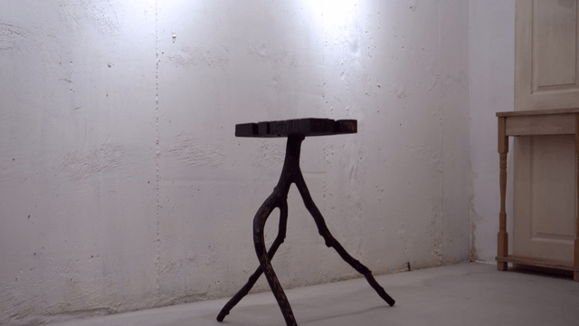 Unique wooden table in a minimalist room