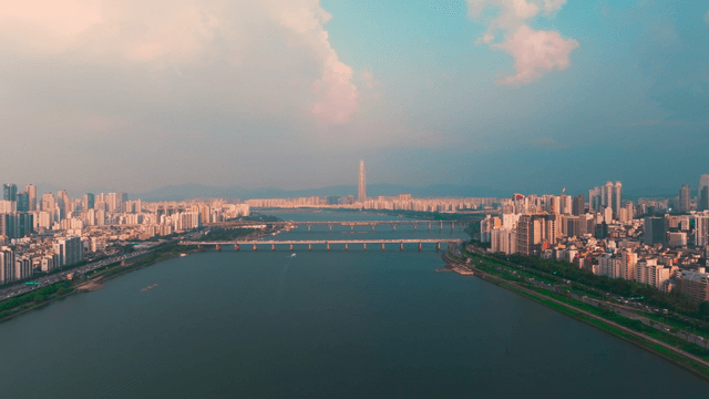 Han River flowing between tall buildings in Seoul