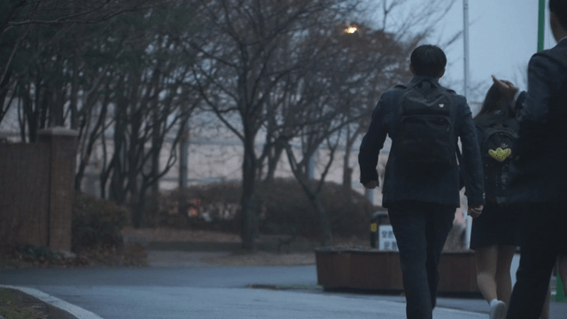Students walking from school in the evening