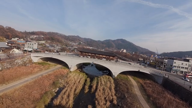 Hanok pavilion located on a bridge over the river
