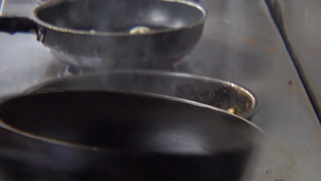 Cooking with flames in a kitchen