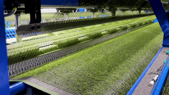 Artificial turf produced by automated machine