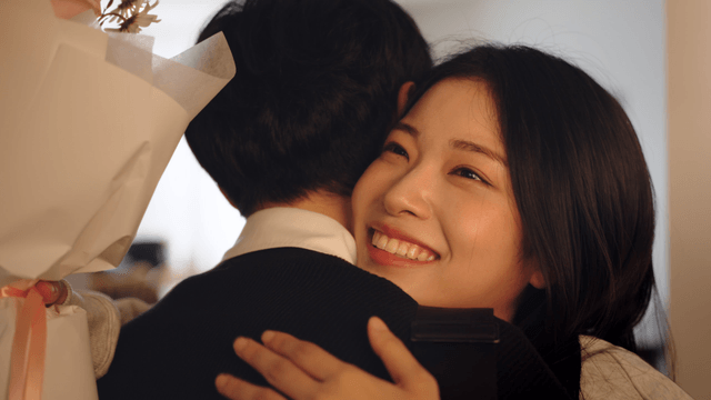 Couple happily exchanging flowers