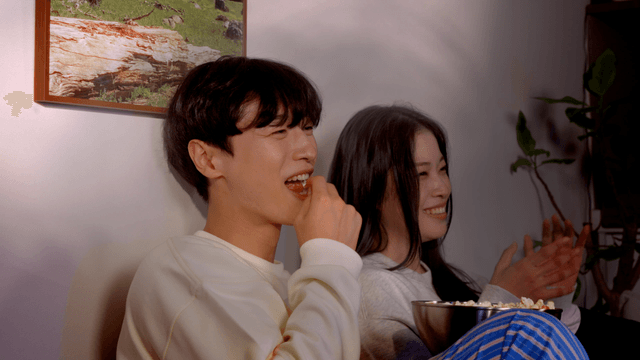 Couple enjoying movie night in cozy home