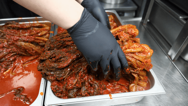 Gatgimchi filling stainless tray in kitchen